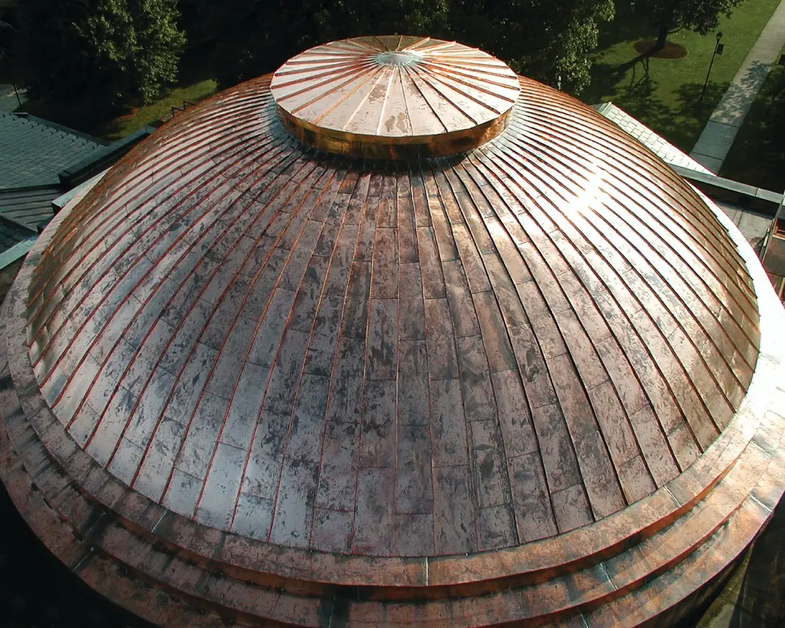 Craftsman Roofing crew installing a new roof in East Gloucester